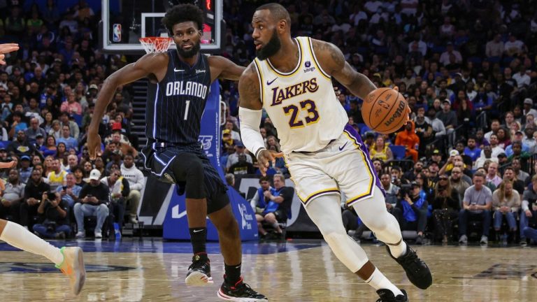 Los Angeles Lakers forward LeBron James drives to the basket past Orlando Magic forward Jonathan Isaac during the first half of an NBA basketball game Saturday, Nov. 4, 2023, in Orlando, Fla. (Gary McCullough/AP Photo)