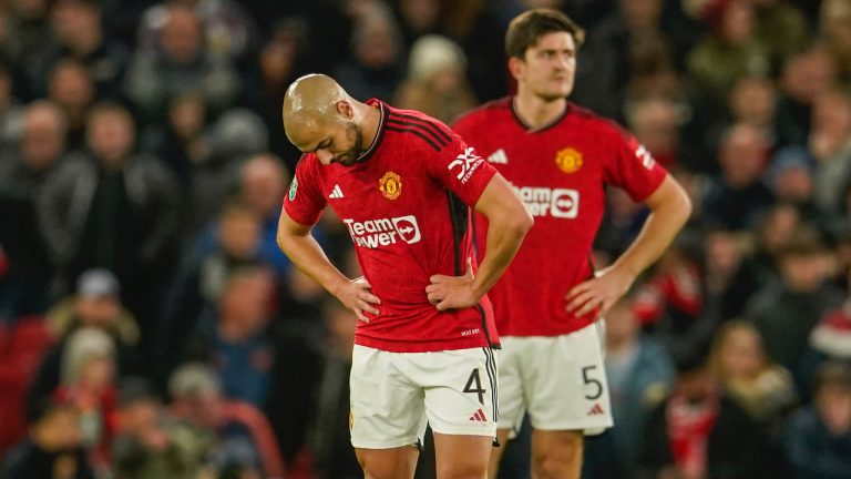 Manchester United's Sofyan Amrabat, front and Manchester United's Harry Maguire react after Newcastle's Joe Willock scoring his side's third goal during the EFL Cup fourth round soccer match between Manchester United and Newcastle at Old Trafford stadium in Manchester, England, Wednesday, Nov. 1, 2023. (Dave Thompson/AP)