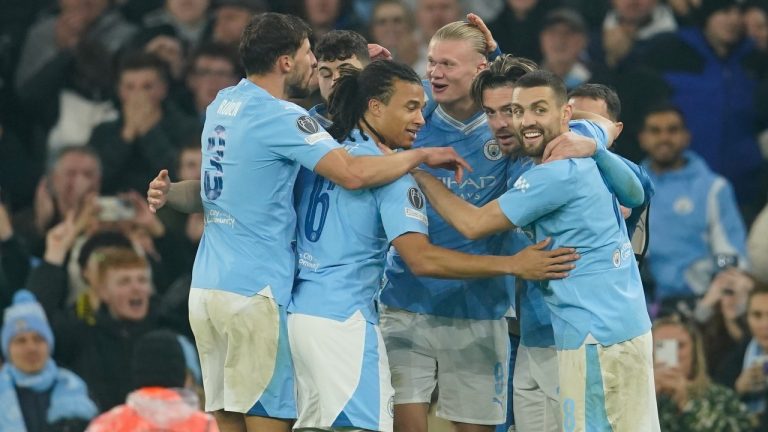 Manchester City's Erling Haaland, centre, celebrates after scoring his side's third goal during the group G Champions League soccer match between Manchester City and Young Boys. (Dave Thompson/AP)