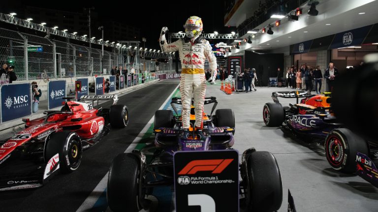 Red Bull driver Max Verstappen, of the Netherlands, stands on top of his car after winning the Formula One Las Vegas Grand Prix auto race, Saturday, Nov. 18, 2023, in Las Vegas. (John Locher/AP)