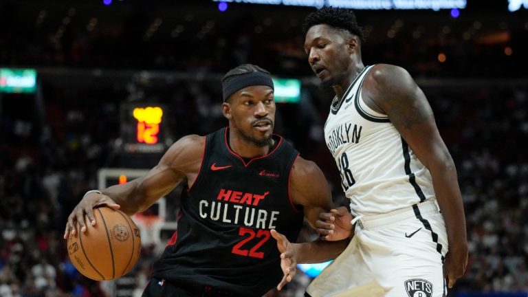 Miami Heat forward Jimmy Butler (22) pushes past Brooklyn Nets forward Dorian Finney-Smith (28) during the first half of an NBA basketball game Thursday, Nov. 16, 2023, in Miami. (Rebecca Blackwell/AP)