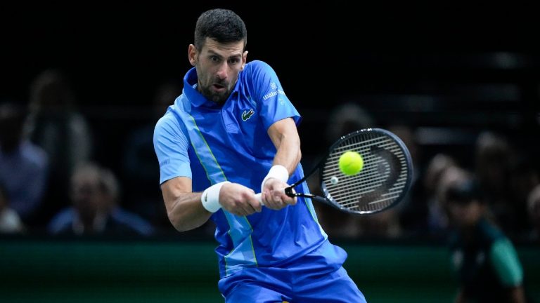 Serbia's Novak Djokovic returns the ball to Bulgaria's Grigor Dimitrov during the final match of the Paris Masters tennis tournament at the Accor Arena, in Paris, Sunday, Nov. 5, 2023. (Michel Euler/AP)