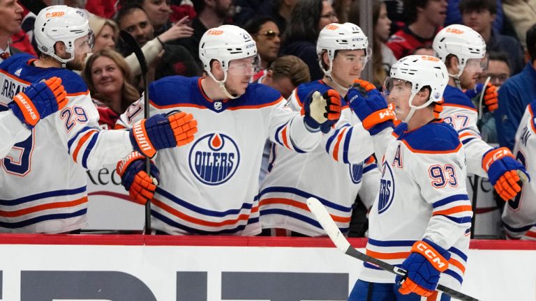 Edmonton Oilers centre Ryan Nugent-Hopkins (93) celebrates with his teammates after scoring in the first period of an NHL hockey game against the Washington Capitals, Friday, Nov. 24, 2023, in Washington. (Mark Schiefelbein/AP)