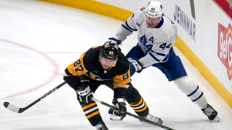 Pittsburgh Penguins' Sidney Crosby (87) controls the puck with Toronto Maple Leafs' Morgan Rielly defending during the first period of an NHL hockey game in Pittsburgh, Saturday, Nov. 25, 2023. (Gene J. Puskar/AP)