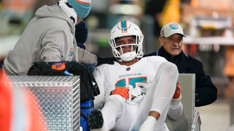 Miami Dolphins linebacker Jaelan Phillips (15) is carted to the locker room after being injured during the second half an NFL football game against the New York Jets, Friday, Nov. 24, 2023, in East Rutherford, N.J. (Bryan Woolston/AP)