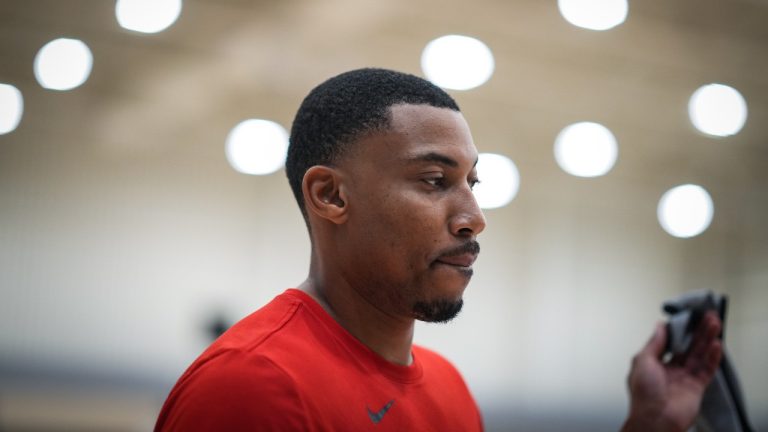 Toronto Raptors forward Otto Porter Jr. walks off the court to talk to reporters during the opening day of the NBA basketball team's training camp. (Darryl Dyck/CP)