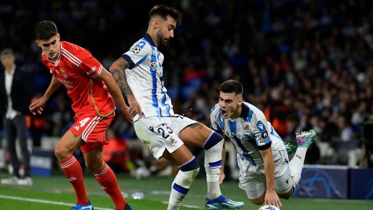 Real Sociedad's Ander Barrenetxea, right, as Brais Mendez, center, stops the ball and Benfica's Antonio Silva looks on during a Group D Champions League soccer match between Real Sociedad and Benfica at the Reala Arena stadium in San Sebastian, Spain, Wednesday, Nov. 8, 2023. (Alvaro Barrientos/AP)