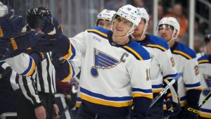 St. Louis Blues centre Brayden Schenn is congratulated for his goal against the Colorado Avalanche during the third period of an NHL hockey game Saturday, Nov. 11, 2023, in Denver. (David Zalubowski/AP)