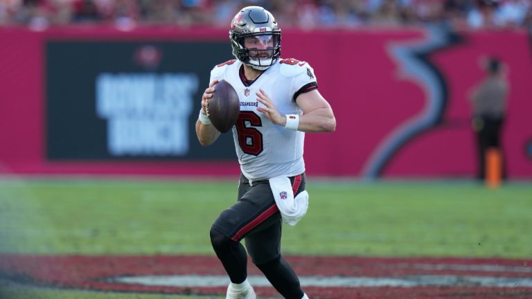 Tampa Bay Buccaneers quarterback Baker Mayfield (6) runs across the field during the second half of an NFL football game against the Tennessee Titans, Sunday, Nov. 12, 2023, in Tampa, Fla. (Chris O'Meara/AP)