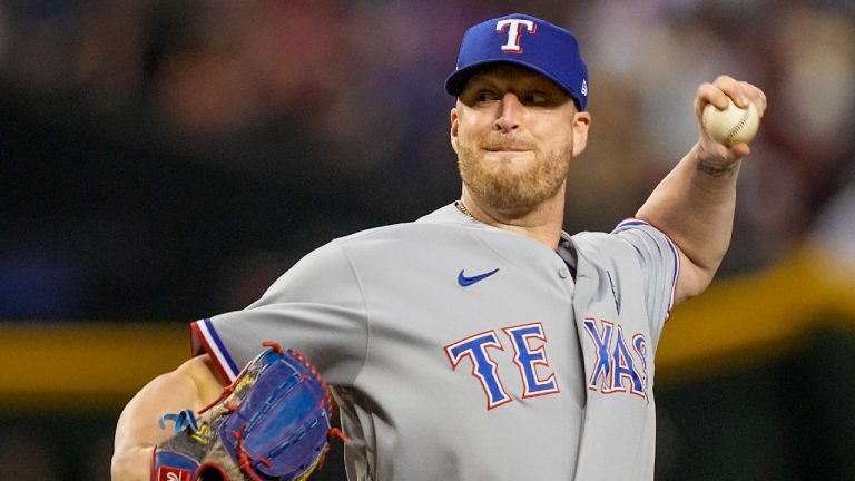 Texas Rangers relief pitcher Will Smith throws against the Arizona Diamondbacks during the ninth inning in Game 4 of the baseball World Series Tuesday, Oct. 31, 2023, in Phoenix. (Brynn Anderson/AP)