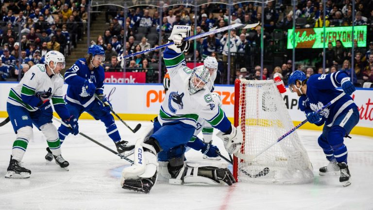 Toronto Maple Leafs right wing William Nylander (right) scores on Vancouver Canucks goaltender Thatcher Demko (35) during second period NHL hockey action, in Toronto on Saturday, Nov. 11, 2023. (Christopher Katsarov/CP)