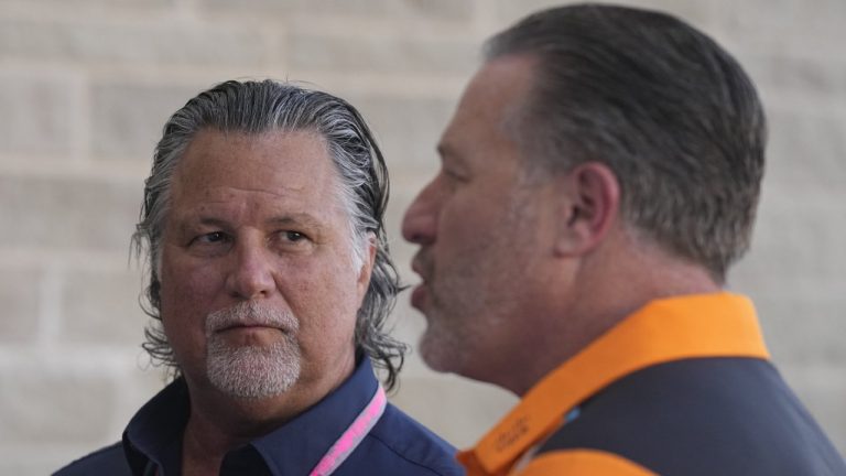 Michael Andretti, left, listens as McLaren CEO Zak Brown speaks in the paddock ahead of the Formula One U.S. Grand Prix auto race at Circuit of the Americas, Friday, Oct. 20, 2023, in Austin, Texas. (Darron Cummings/AP)