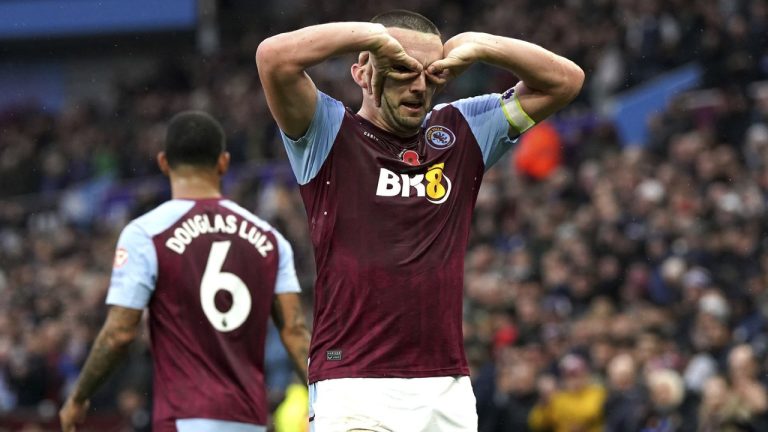 Aston Villa's John McGinn celebrates scoring their side's second goal of the game during the Premier League match between Aston Villa and Fulham FC at Villa Park in Birmingham, England, Sunday Nov. 12, 2023. (Nick Potts/PA via AP)