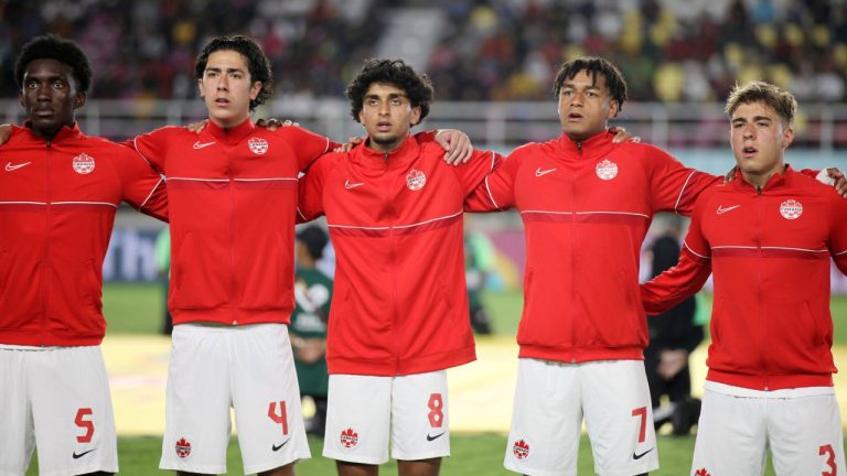 Canadians Chimere Omeze, Alessandro Biello, Jeevan Badwal, Taryck Tahid and Gael de Montigny sing "O Canada" on Nov. 10, 2023, before playing Spain at the FIFA U-17 World Cup Indonesia 2023. (THE CANADIAN PRESS/HO-Canada Soccer)