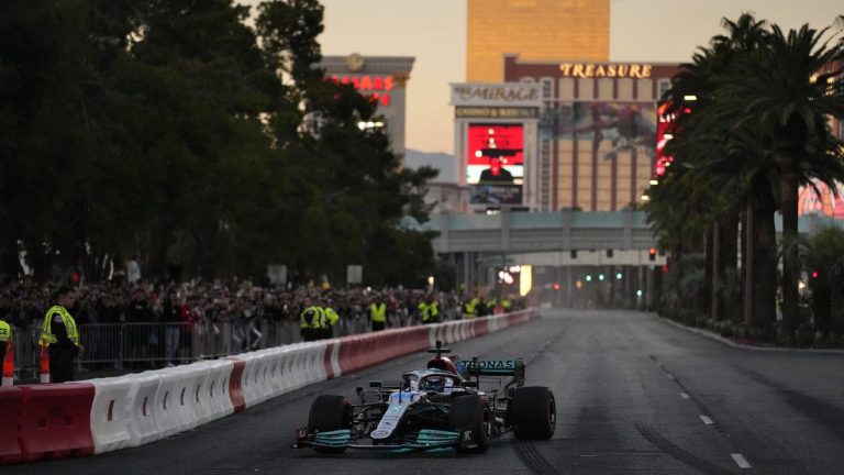 FILE - George Russell drives during a demonstration along the Las Vegas Strip at a launch party for the Formula One Las Vegas Grand Prix, Saturday, Nov. 5, 2022, in Las Vegas. There’s no such thing as a flawless first-year event, so go ahead and accept there will be bumps and bruises in Formula One’s $500 million Las Vegas Grand Prix. (John Locher/AP)