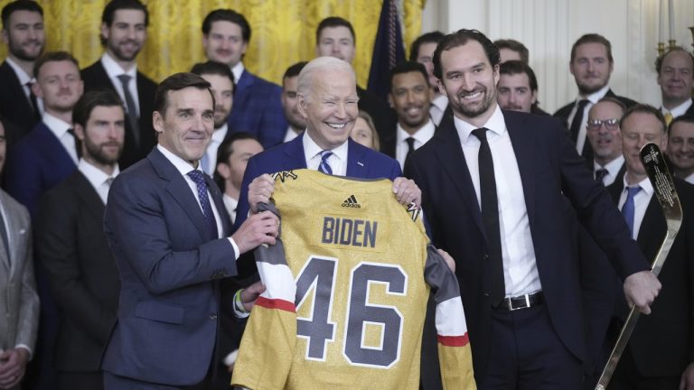 President Joe Biden holds a jersey during an event to celebrate the Vegas Golden Knights in their 2023 Stanley Cup victory in the East Room of the White House, Monday, Nov. 13, 2023, in Washington. (Andrew Harnik/AP)