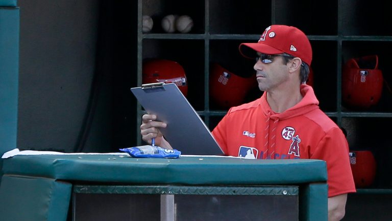 Los Angeles Angels manager Brad Ausmus picks up his clipboard after the last out in the ninth inning as the Houston Astros defeat his team in a baseball game in Anaheim, Calif., Sunday, Sept. 29, 2019. (Alex Gallardo/AP)