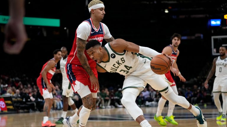 Milwaukee Bucks forward Giannis Antetokounmpo (34) drives against Washington Wizards forward Kyle Kuzma during the first half of an NBA basketball game, Monday, Nov. 20, 2023, in Washington. (Mark Schiefelbein/AP)