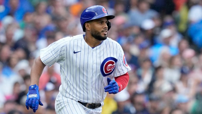 Chicago Cubs' Jeimer Candelario watches his hit during a baseball game against the Atlanta Braves Saturday, Aug. 5, 2023, in Chicago. (Charles Rex Arbogast/AP Photo)