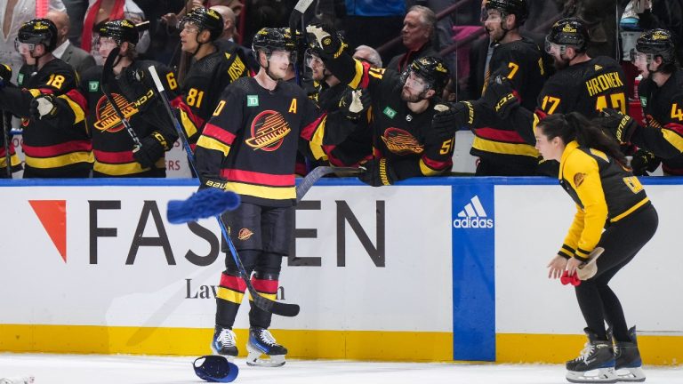 Hats are thrown on the ice as Vancouver Canucks' Elias Pettersson celebrates his third goal against the Nashville Predators during the third period of an NHL hockey game, in Vancouver, on Tuesday, October 31, 2023. (Darryl Dyck/THE CANADIAN PRESS)