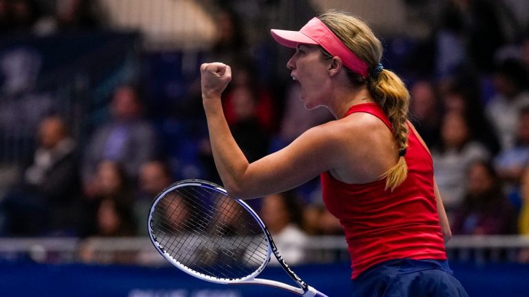 US Danielle Collins celebrates after defeating Switzerland's Celine Naef during their group stage tennis match at the Billie Jean King Cup finals. (Manu Fernandez/AP)