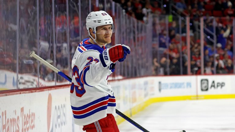 New York Rangers' Adam Fox (23) celebrates his game-winning goal against the Carolina Hurricanes during the third period of an NHL hockey game in Raleigh, N.C., Thursday, March 23, 2023. (Karl B DeBlaker/AP Photo)