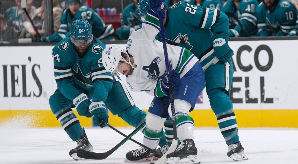 Red-hot Canucks score 10 goals, demolish winless Sharks