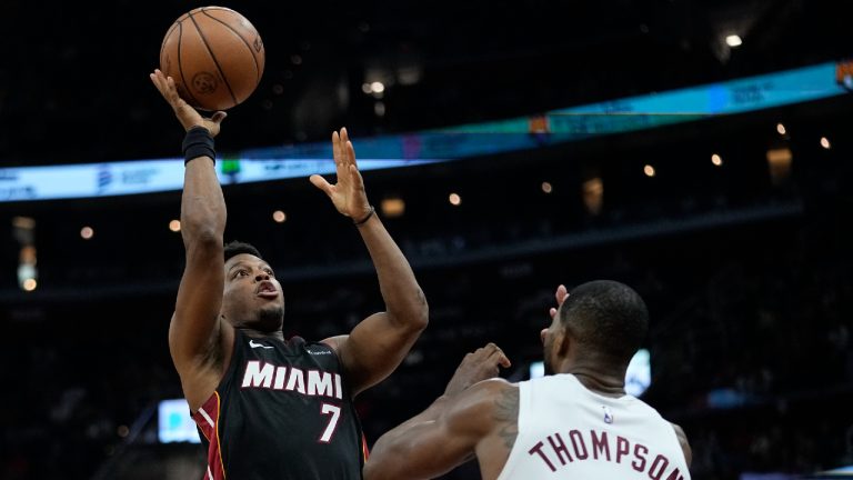 Miami Heat guard Kyle Lowry (7) shoots over Cleveland Cavaliers center Tristan Thompson (12) during the second half of an NBA basketball game Wednesday, Nov. 22, 2023, in Cleveland. (Sue Ogrocki/AP)