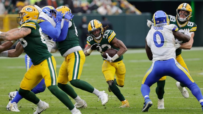 Green Bay Packers running back Aaron Jones (33) runs with the football during the second half of an NFL football game against the Los Angeles Rams, Sunday, Nov. 5, 2023, in Green Bay, Wis. (Mike Roemer/AP)