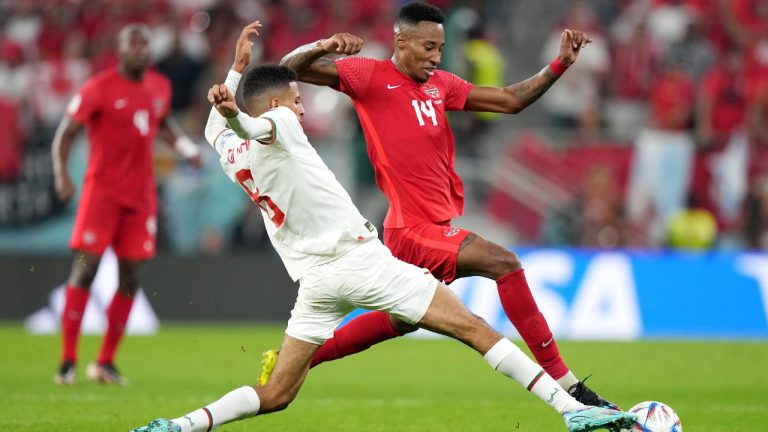 Canada midfielder Mark-Anthony Kaye (14) moves the ball as Morocco midfielder Azzedine Ounahi (8) defends during first half group F World Cup soccer action at the Al Thumama Stadium in Doha, Qatar on Thursday, December 1, 2022. (Nathan Denette/CP)