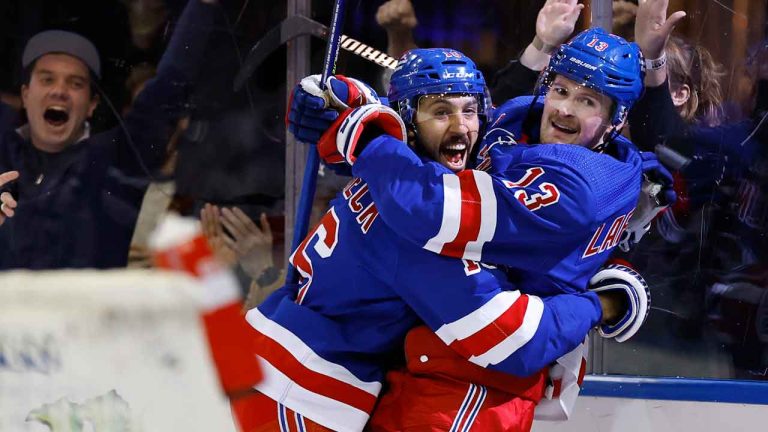 New York Rangers left wing Alexis Lafreniere celebrates with center Vincent Trocheck, left, after scoring a goal against the Columbus Blue Jackets during the second period of an NHL hockey game. (Noah K. Murray/AP)