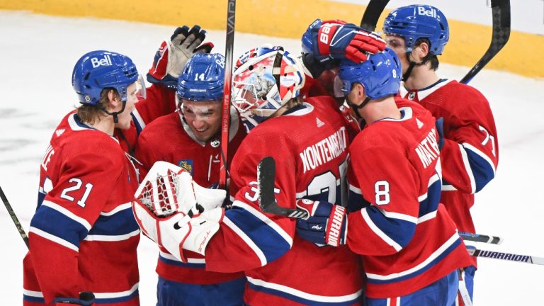 Montreal Canadiens goaltender Samuel Montembeault (35) celebrates with teammates after defeating the Chicago Blackhawks in an NHL hockey game in Montreal, Saturday, Oct. 14, 2023. (Graham Hughes/CP)