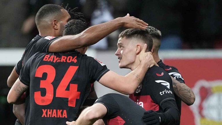 Leverkusen's Florian Wirtz is celebrated after he scored his side's third goal during the German Bundesliga soccer match between Bayer Leverkusen and Eintracht Frankfurt at the BayArena in Leverkusen. (Martin Meissner/AP)
