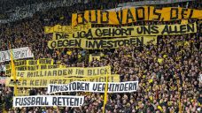 German soccer fans fall silent to protest Bundesliga investment deal