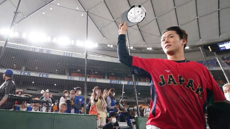 Yoshinobu Yamamoto of Japan greets fans prior to the quarterfinal game between Italy and Japan at the World Baseball Classic (WBC) at Tokyo Dome in Tokyo, Japan, Thursday, March 16, 2023. (Toru Hanai/AP)