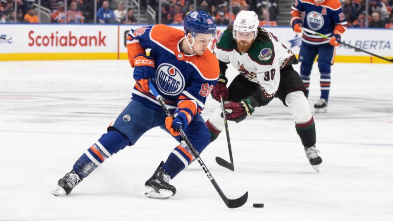 Edmonton Oilers' Philip Broberg is pursued by the Arizona Coyotes' Liam O'Brien during third period NHL action in Edmonton on Wednesday March 22, 2023. (Jason Franson/CP)