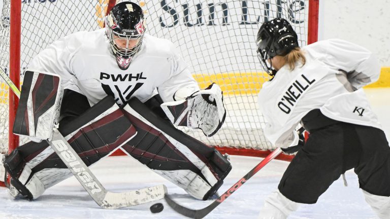 Montreal's Kristin O'Neill moves in on goaltender Ann-Renee Desbiens during the Professional Women's Hockey League’s (PWHL) training camp in Montreal, Saturday, November 18, 2023. (Graham Hughes/CP)