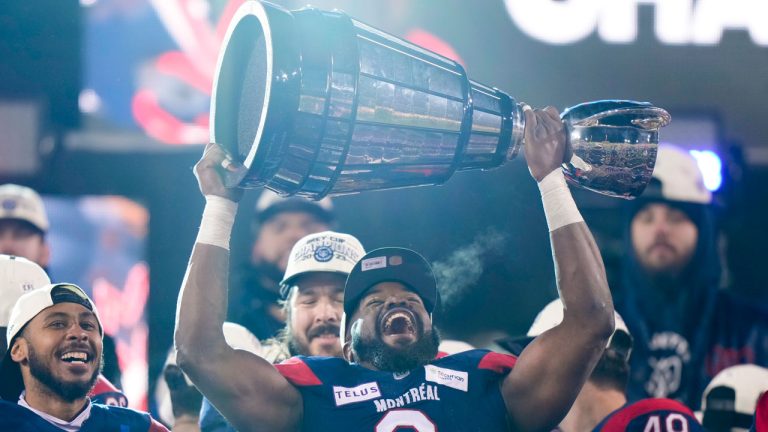 Montreal Alouettes defensive end Shawn Lemon (0) hoists the Grey Cup as the Alouettes celebrate defeating the Winnipeg Blue Bombers in the 110th CFL Grey Cup in Hamilton, Ont., on Sunday, November 19, 2023. (Frank Gunn/CP)