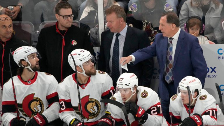 Ottawa Senators interim coach Jacques Martin, right, talks to players during the third period of the team's NHL hockey game against the Arizona Coyotes, Tuesday, Dec. 19, 2023, in Tempe, Ariz. (Rick Scuteri/AP) 