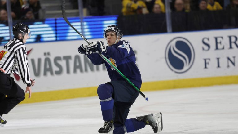 Finland's Kasper Halttunen scores his side's third goal during the IIHF World Junior Championship group A ice hockey match between Sweden and Finland at Scandinavium in Gothenburg, Sweden, Sunday, Dec. 31, 2023. (Adam Ihse/TT News Agency via AP)