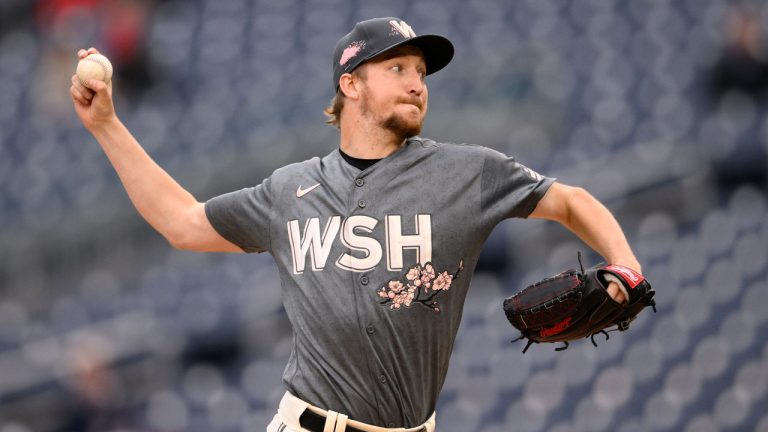 Washington Nationals starting pitcher Erick Fedde throws during the fourth inning of the first baseball game of a doubleheader against the Philadelphia Phillies, Friday, Sept. 30, 2022, in Washington. (Nick Wass/AP)