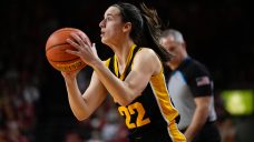 Clark&#8217;s 35 points moves her past 3,000 and helps Iowa escape rival Iowa State