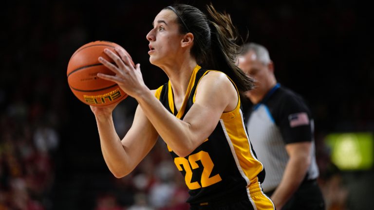 Iowa guard Caitlin Clark (22) shoots during the first half of an NCAA college basketball game against Iowa State, Wednesday, Dec. 6, 2023, in Ames, Iowa. (Charlie Neibergall/AP)