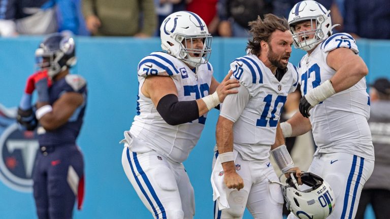 Indianapolis Colts quarterback Gardner Minshew (10) celebrates with offensive tackle Bernhard Raimann (79) and offensive tackle Blake Freeland (73) after throwing the winning touch to defeat the Tennessee Titans in overtime of their NFL football game Sunday, Dec. 3, 2023, in Nashville, Tenn. (Wade Payne/AP)