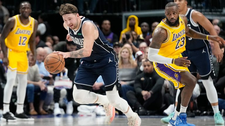 Dallas Mavericks guard Luka Doncic (77) comes up with the steal against Los Angeles Lakers forward LeBron James (23) during the first half of an NBA basketball game in Dallas, Tuesday, Dec. 12, 2023. (LM Otero/AP)