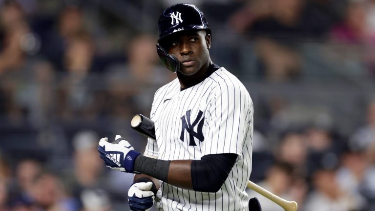 New York Yankees' Estevan Florial reacts walking back to the dugout after striking out during the seventh inning of the team's baseball game against the Toronto Blue Jays on Thursday, Aug. 18, 2022, in New York. The Blue Jays won 9-2. (AP Photo/Adam Hunger)