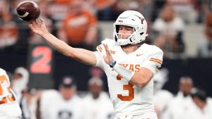 Texas quarterback Quinn Ewers throws a pass in the first half of the Big 12 Conference championship NCAA college football game against Oklahoma State in Arlington, Texas, Saturday, Dec. 2, 2023. (Tony Gutierrez/AP)