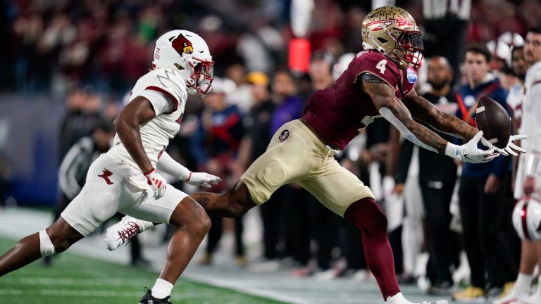 Louisville defensive back Quincy Riley, left, defends on an incomplete pass to Florida State wide receiver Keon Coleman during the first half of the Atlantic Coast Conference championship NCAA college football game Saturday, Dec. 2, 2023, in Charlotte, N.C. (Erik Verduzco/AP)