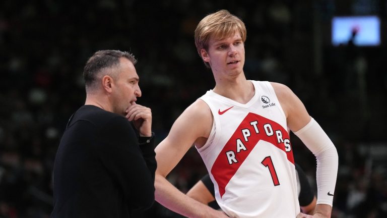 Toronto Raptors Head Coach Darko Rajakovic talks with Gradey Dick during preseason NBA basketball action against the Washington Wizards in Toronto on Friday October 20, 2023. THE CANADIAN PRESS/Chris Young