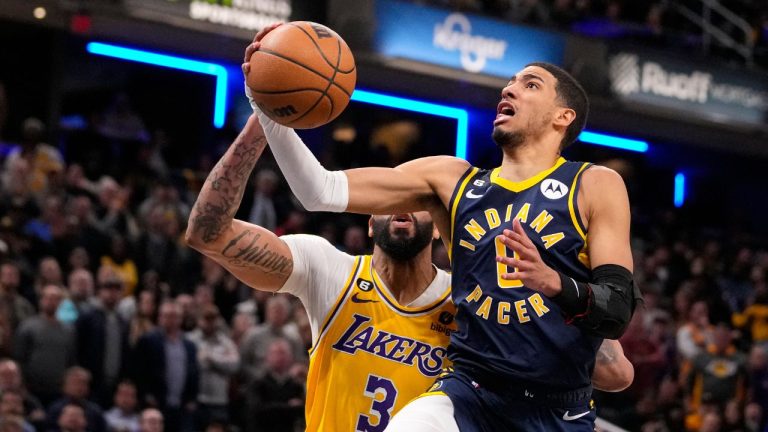 Indiana Pacers guard Tyrese Haliburton shoots in front of Los Angeles Lakers forward Anthony Davis during the second half of an NBA basketball game in Indianapolis, Thursday, Feb. 2, 2023. The Lakers defeated the Pacers 112-111. (Michael Conroy/AP Photo)